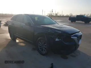 2021 Mazda CX-9 Touring with VIN JM3TCACYXM0516875, listed as a IAAI auction lot 41175400 with 64,429 mi miles. Bid and sale history available at carsss.com. Image 1.