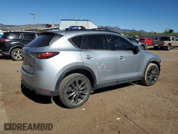 2019 Mazda CX-5 Grand Touring with VIN JM3KFADM6K0543888, listed as a Copart auction lot 56310785 with 112,737 mi miles and Salvage title. Bid and sale history available at DreamBid. Image 3.