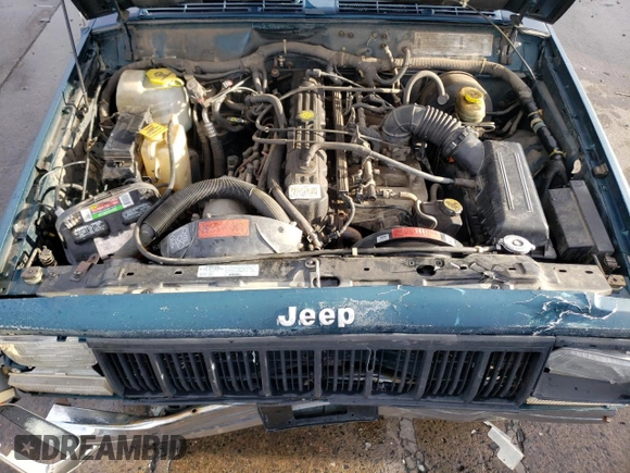 1996 Jeep Cherokee SE z VIN 1J4FJ28S6TL184205, wystawiony jako Copart lot #77558034 z przebiegiem 195 000 mil mil oraz Tytuł czysty. Historia ofert i sprzedaży dostępna na DreamBid. Obrazek 12.