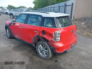 2012 MINI Countryman S with VIN WMWZC5C54CWM13041, listed as a IAAI auction lot 42244303 with 139,733 mi miles and . Bid and sale history available at DreamBid. Image 3.