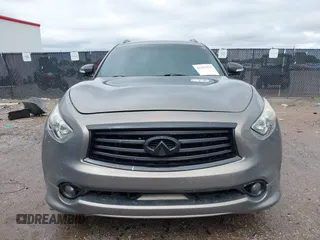 2014 Infiniti QX70 z VIN JN8CS1MU3EM451745, wystawiony jako IAAI lot #42203922 z przebiegiem 144 990 mil mil oraz . Historia ofert i sprzedaży dostępna na DreamBid. Obrazek 12.