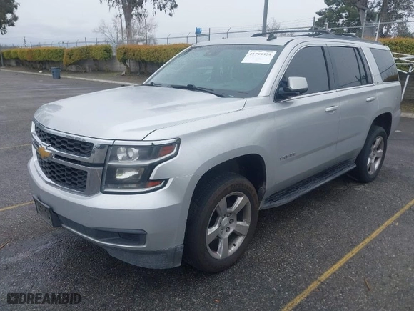 2015 Chevrolet Tahoe LT with VIN 1GNSCBKC5FR121069, listed as a IAAI auction lot 41799529 with 216,869 mi miles. Bid and sale history available at carsss.com. Image 2.