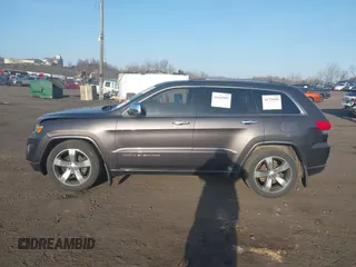 2015 Jeep Grand Cherokee Overland with VIN 1C4RJFCT3FC725239, listed as a IAAI auction lot 41779555 with 100,837 mi miles. Bid and sale history available at carsss.com. Image 14.