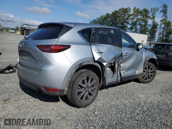 2018 Mazda CX-5 Grand Touring с VIN JM3KFBDM5J0323923, выставлен на аукционе Copart как лот 58162435 с пробегом 144 792 миль миль и Списание • Salvage title. История ставок и продаж доступна на DreamBid. Изображение 3.