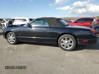 2003 Ford Thunderbird Deluxe z VIN 1FAHP60A63Y104093, wystawiony jako Copart lot #76028744 z przebiegiem 79 995 mil mil oraz Szkoda całkowita • Salvage title. Historia ofert i sprzedaży dostępna na DreamBid. Obrazek 2.