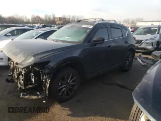 2021 Mazda CX-5 Signature with VIN JM3KFBEY2M0345187, listed as a Copart auction lot 82786984 with 98,014 mi miles and Salvage Title. Bid and sale history available at carsss.com. Image 1.