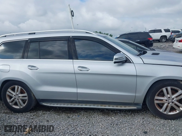2014 Mercedes-Benz GL 450 z VIN 4JGDF7CE4EA347876, wystawiony jako IAAI lot #42386949 z przebiegiem 133 400 mil mil oraz . Historia ofert i sprzedaży dostępna na DreamBid. Obrazek 13.