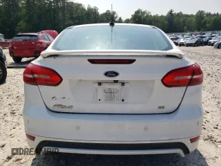 2015 Ford Focus SE with VIN 1FADP3F28FL332899, listed as a Copart auction lot 60055185 with 76,948 mi miles and Clean title. Bid and sale history available at DreamBid. Image 6.