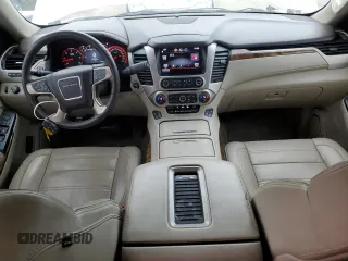 2015 GMC Yukon Denali with VIN 1GKS1CKJ1FR619793, listed as a Copart auction lot 86910314 with 128,559 mi miles and Salvage Title. Bid and sale history available at carsss.com. Image 8.