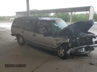 1999 GMC Yukon with VIN 1GKEC13R4XJ735246, listed as a Copart auction lot 56429874 with 258,616 mi miles and Salvage Title. Bid and sale history available at carsss.com. Image 4.
