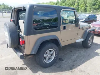 2005 Jeep Wrangler Sport with VIN 1J4FA49SX5P317120, listed as a IAAI auction lot 42677397 with 71,403 mi miles and . Bid and sale history available at DreamBid. Image 4.