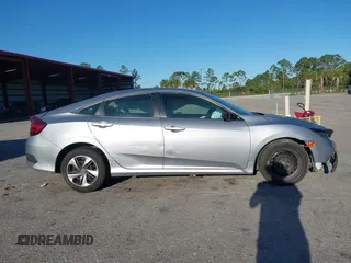 2020 Honda Civic LX with VIN 19XFC2F63LE004953, listed as a IAAI auction lot 41824922 with 71,458 mi miles and . Bid and sale history available at DreamBid. Image 13.