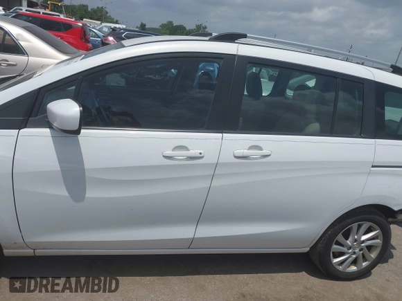 2012 Mazda 5 Sport with VIN JM1CW2BLXC0114770, listed as a IAAI auction lot 42147656 with 99,908 mi miles and . Bid and sale history available at DreamBid. Image 14.