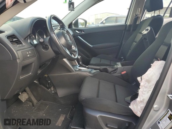 2014 Mazda CX-5 Touring z VIN JM3KE2CY0E0412733, wystawiony jako Copart lot #55803865 z przebiegiem 161 539 mil mil oraz Szkoda całkowita • Salvage title. Historia ofert i sprzedaży dostępna na DreamBid. Obrazek 7.