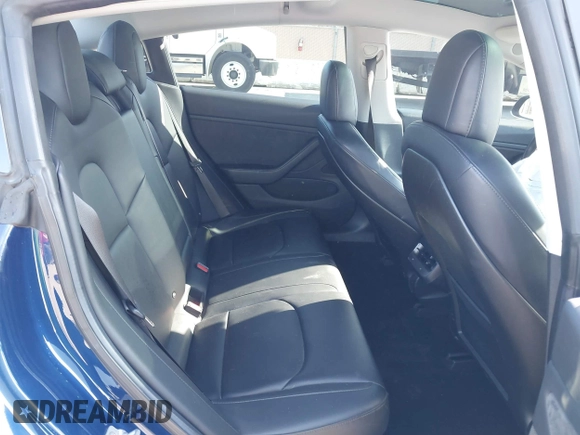 2018 Tesla Model 3 Long Range Battery with VIN 5YJ3E1EA4JF011799, listed as a IAAI auction lot 41765860 with 133,098 mi miles. Bid and sale history available at carsss.com. Image 8.