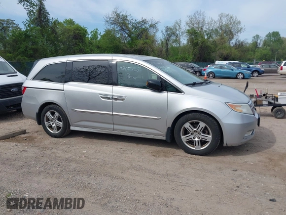 2012 Honda Odyssey Touring with VIN 5FNRL5H92CB055473, listed as a IAAI auction lot 42128601 with 163,901 mi miles. Bid and sale history available at carsss.com. Image 13.
