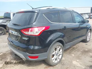2014 Ford Escape Titanium with VIN 1FMCU0JX1EUD71953, listed as a IAAI auction lot 42036023 with 165,624 mi miles. Bid and sale history available at carsss.com. Image 4.