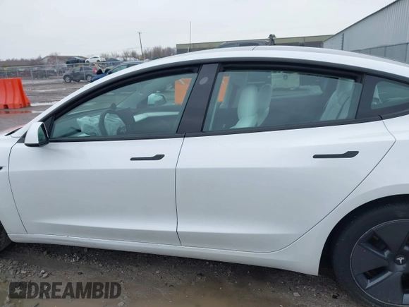 2022 Tesla Model 3 Long Range with VIN 5YJ3E1EB6NF272009, listed as a IAAI auction lot 41984154 with 12,651 mi miles and . Bid and sale history available at DreamBid. Image 14.