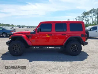 2020 Jeep Wrangler Unlimited Rubicon with VIN 1C4HJXFG9LW106607, listed as a IAAI auction lot 41908295 with 71,083 mi miles and . Bid and sale history available at DreamBid. Image 14.