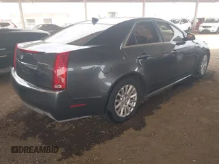 2011 Cadillac CTS Luxury with VIN 1G6DF5EY6B0104932, listed as a IAAI auction lot 42032457 with 165,833 mi miles and . Bid and sale history available at DreamBid. Image 4.