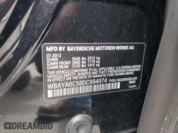 2013 BMW 7 Series 740i with VIN WBAYA6C58DC994974, listed as a Copart auction lot 55534645 with 106,975 mi miles and Salvage title. Bid and sale history available at DreamBid. Image 12.