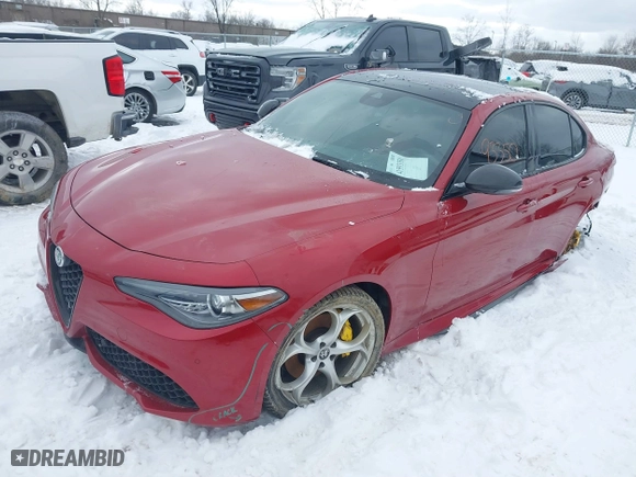 2021 Alfa Romeo Giulia Ti with VIN ZARFANBN5M7641290, listed as a IAAI auction lot 41593350 with 59,664 mi miles. Bid and sale history available at carsss.com. Image 2.