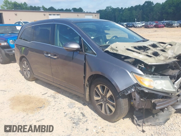 2015 Honda Odyssey Touring Elite with VIN 5FNRL5H95FB127156, listed as a IAAI auction lot 42618059 with 160,074 mi miles and . Bid and sale history available at DreamBid. Image 1.