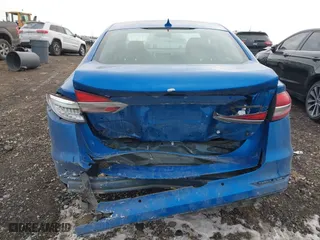 2019 Ford Fusion Hybrid SE with VIN 3FA6P0LUXKR131563, listed as a IAAI auction lot 41448736 with 165,440 mi miles. Bid and sale history available at carsss.com. Image 16.