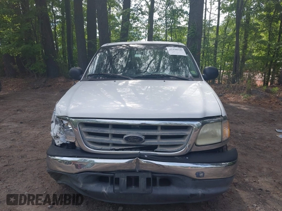 2003 Ford F-150 XLT with VIN 1FTRW07663KD69809, listed as a IAAI auction lot 42198549 with 166,466 mi miles and . Bid and sale history available at DreamBid. Image 12.