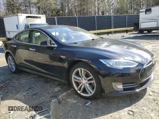 2014 Tesla Model S 60 with VIN 5YJSA1H10EFP34137, listed as a Copart auction lot 47645795 with Not provided miles and Salvage title. Bid and sale history available at DreamBid. Image 4.
