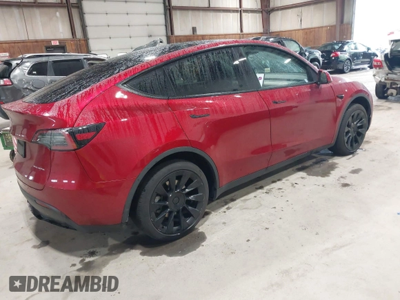 2024 Tesla Model Y Long Range with VIN 7SAYGAEE2RF986206, listed as a IAAI auction lot 42177852 with 14,399 mi miles and . Bid and sale history available at DreamBid. Image 4.