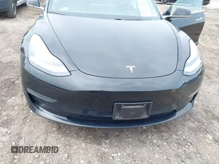 2019 Tesla Model 3 Mid Range with VIN 5YJ3E1EA2KF395549, listed as a IAAI auction lot 41895977 with 97,108 mi miles and . Bid and sale history available at carsss.com. Image 6.