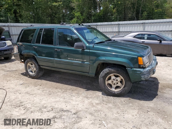 1998 Jeep Grand Cherokee Laredo with VIN 1J4GZ48S5WC289251, listed as a Copart auction lot 63594685 with 156,358 mi miles and Salvage title. Bid and sale history available at DreamBid. Image 4.