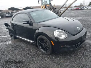 2014 Volkswagen Beetle 2.5L w/Sun with VIN 3VWJP7AT3EM608906, listed as a IAAI auction lot 41501830 with 42,804 mi miles and . Bid and sale history available at DreamBid. Image 1.