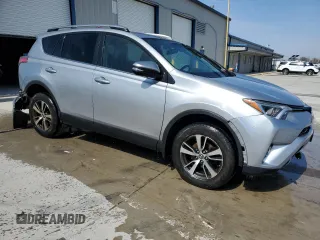 2018 Toyota RAV4 XLE with VIN 2T3RFREV3JW740122, listed as a Copart auction lot 51339045 with 115,293 mi miles and Salvage Title. Bid and sale history available at DreamBid. Image 4.