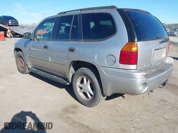 2004 GMC Envoy SLE with VIN 1GKDT13S642213710, listed as a IAAI auction lot 41680656 with 239,187 mi miles. Bid and sale history available at carsss.com. Image 3.