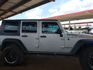 2010 Jeep Wrangler Unlimited Sport with VIN 1J4BA3H18AL161243, listed as a IAAI auction lot 41960370 with 89,004 mi miles. Bid and sale history available at carsss.com. Image 13.