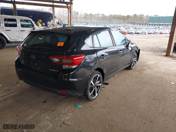 2020 Subaru Impreza with VIN 4S3GTAA64L1716459, listed as a IAAI auction lot 41673940 with 29,929 mi miles. Bid and sale history available at carsss.com. Image 4.