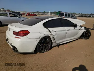 2015 BMW M6 z VIN WBS6C9C51FD467998, wystawiony jako Copart lot #67775934 z przebiegiem Nie podano mil oraz Szkody całkowita. Historia ofert i sprzedaży dostępna na DreamBid. Obrazek 3.