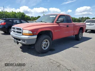 1999 Dodge Dakota SLT z VIN 1B7GG22Y0XS252760, wystawiony jako Copart lot #61674435 z przebiegiem 153 402 mil mil oraz Czysty tytuł • Clean title. Historia ofert i sprzedaży dostępna na DreamBid. Obrazek 1.
