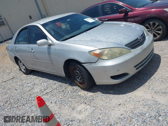 2002 Toyota Camry XLE z VIN 4T1BF32K42U531992, wystawiony jako IAAI lot #42294926 z przebiegiem 294 929 mil mil oraz . Historia ofert i sprzedaży dostępna na DreamBid. Obrazek 1.