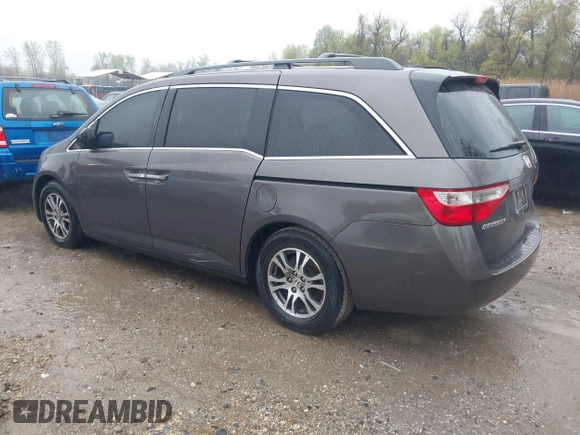 2012 Honda Odyssey EX-L with VIN 5FNRL5H6XCB057557, listed as a IAAI auction lot 42022410 with 174,286 mi miles and . Bid and sale history available at DreamBid. Image 3.