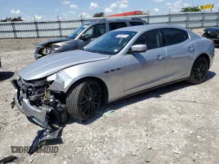 2015 Maserati Ghibli S Q4 with VIN ZAM57RTAXF1130070, listed as a Copart auction lot 58033215 with 56,461 mi miles and Salvage title. Bid and sale history available at DreamBid. Image 1.