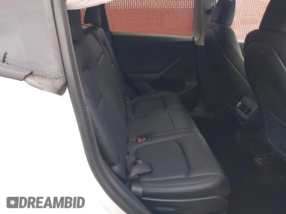 2023 Tesla Model Y Long Range with VIN 7SAYGAEE9PF702910, listed as a IAAI auction lot 42199519 with 91,094 mi miles and . Bid and sale history available at DreamBid. Image 8.
