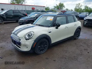 2015 MINI Hardtop 4 Door with VIN WMWXS5C52FT831291, listed as a IAAI auction lot 42179801 with 63,261 mi miles and . Bid and sale history available at DreamBid. Image 18.