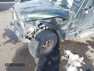 1998 Jeep Wrangler Sahara z VIN 1J4FY49S3WP744619, wystawiony jako IAAI lot #41107702 z przebiegiem 105 432 mil mil oraz . Historia ofert i sprzedaży dostępna na DreamBid. Obrazek 6.