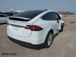 2018 Tesla Model X 75D with VIN 5YJXCBE26JF140049, listed as a IAAI auction lot 41712865 with 48,684 mi miles. Bid and sale history available at carsss.com. Image 4.