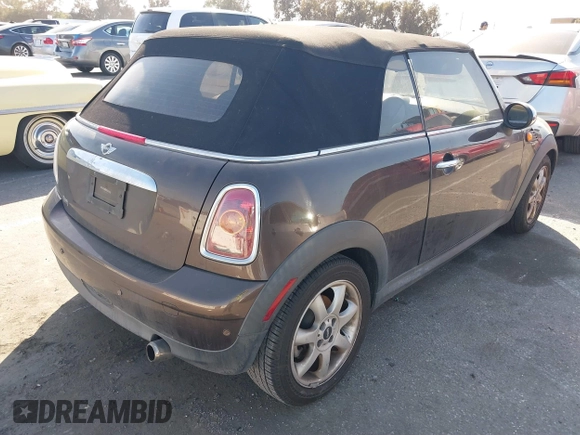 2010 MINI Convertible with VIN WMWMR3C50ATU97550, listed as a IAAI auction lot 41709012 with 86,499 mi miles and . Bid and sale history available at DreamBid. Image 4.