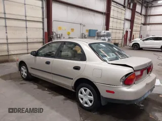 1998 Mazda Protege DX z VIN JM1BC1419W0171802, wystawiony jako IAAI lot #42202861 z przebiegiem 252 304 mil mil oraz . Historia ofert i sprzedaży dostępna na DreamBid. Obrazek 3.