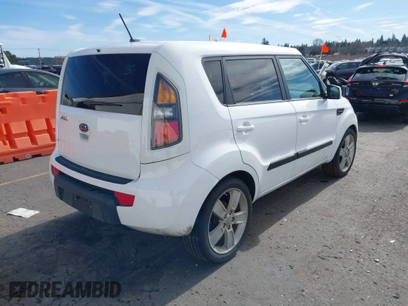 2011 Kia Soul + with VIN KNDJT2A23B7267442, listed as a IAAI auction lot 41671119 with 123,577 mi miles. Bid and sale history available at carsss.com. Image 4.